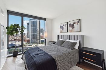 Floor-to-ceiling windows* featuring breathtaking skyline & river views